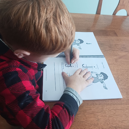 Pride Reading Program working in workbook